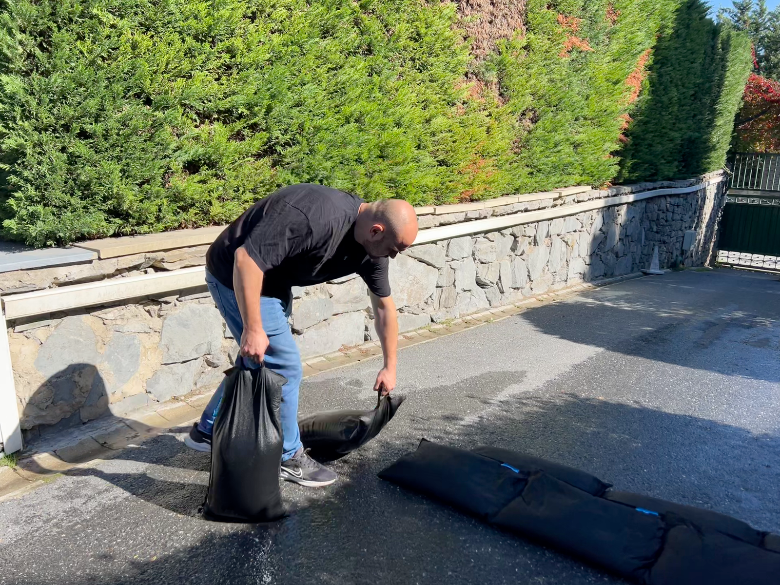 Person placing SUPER BLOC bags by hand